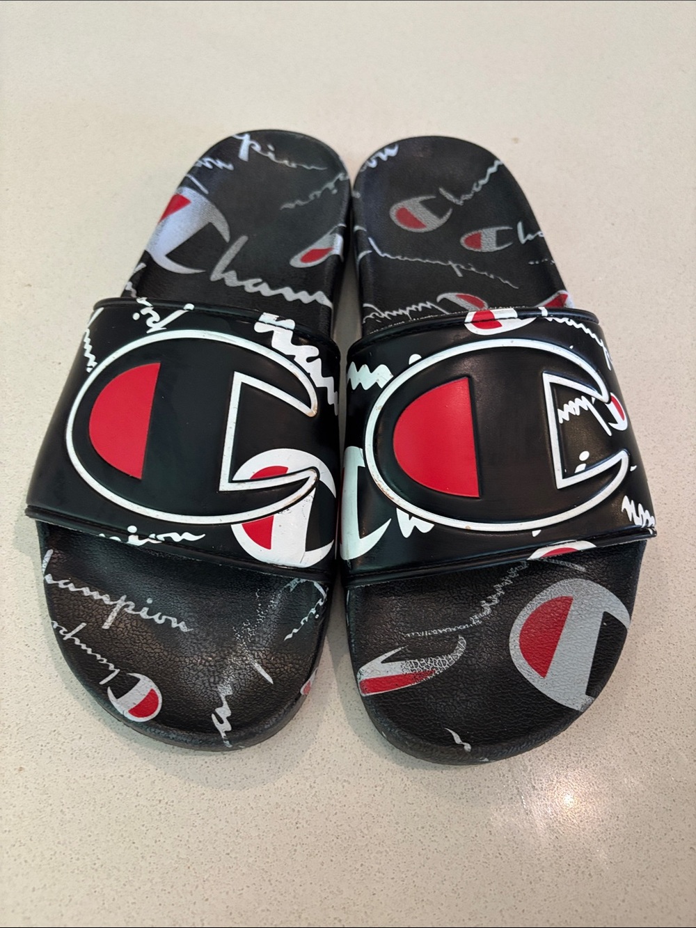 Champion Black Slides with Red & White Logo Pattern